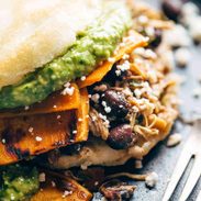 Arepas on a plate with a fork.