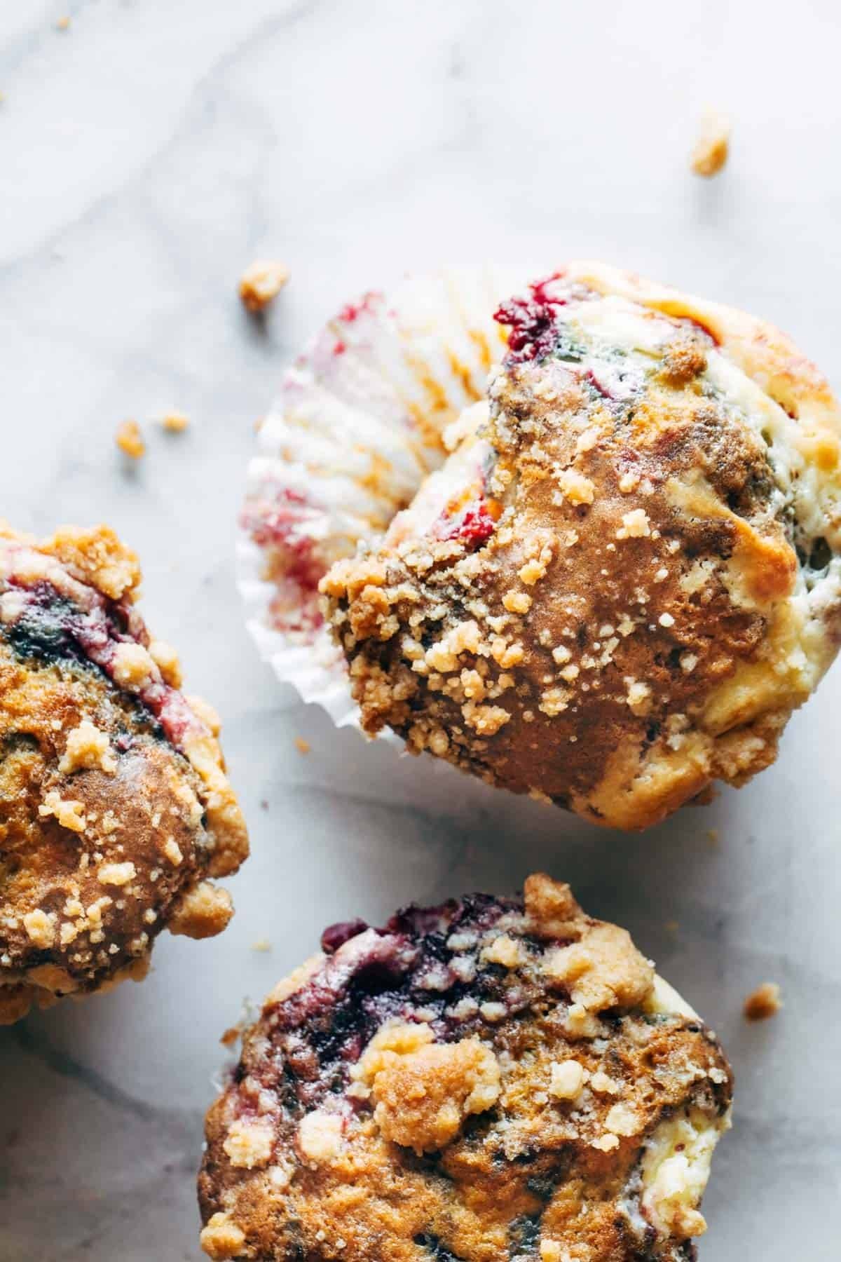 Berry cheesecake muffins in liners.