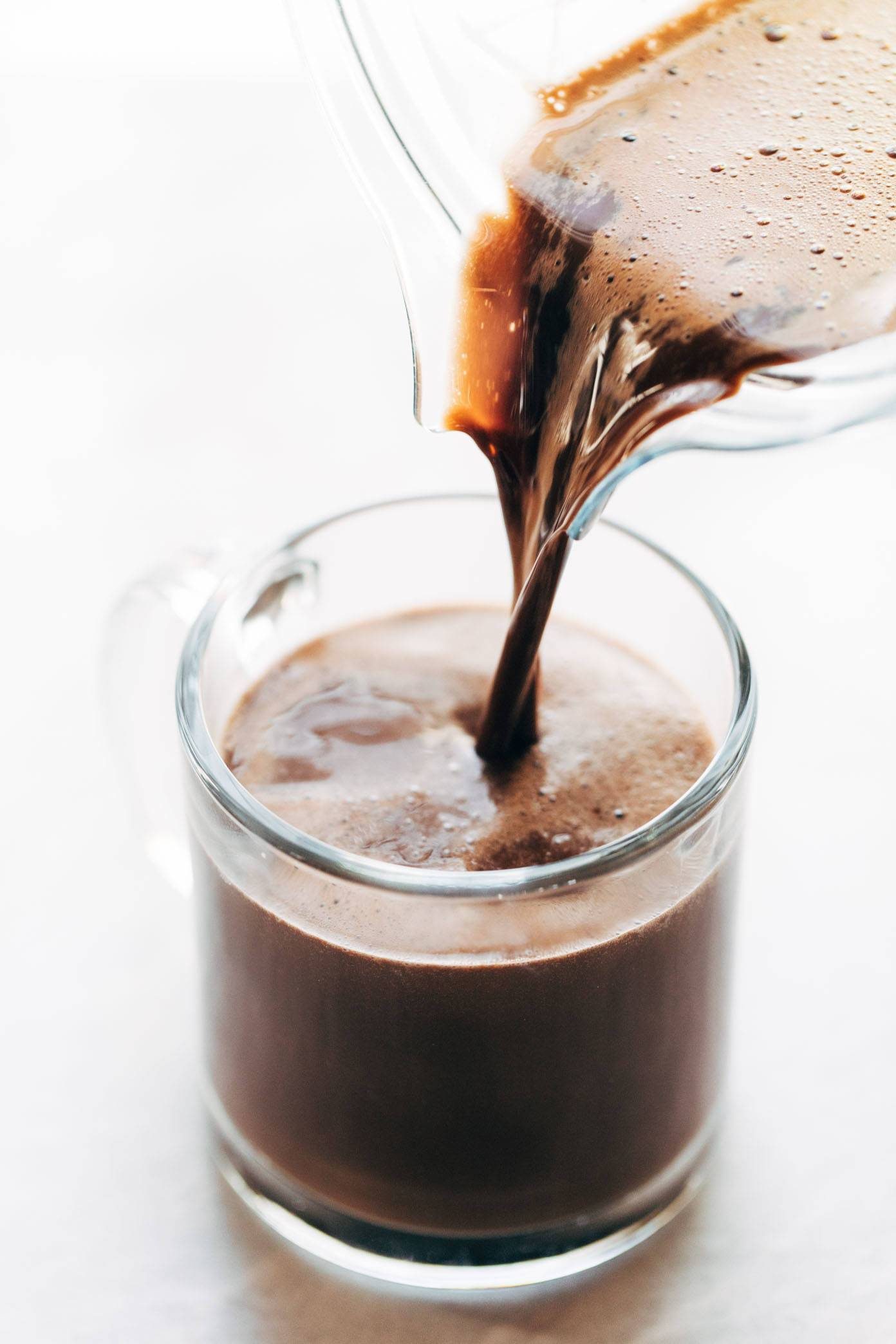 Pouring peppermint mocha into glass.
