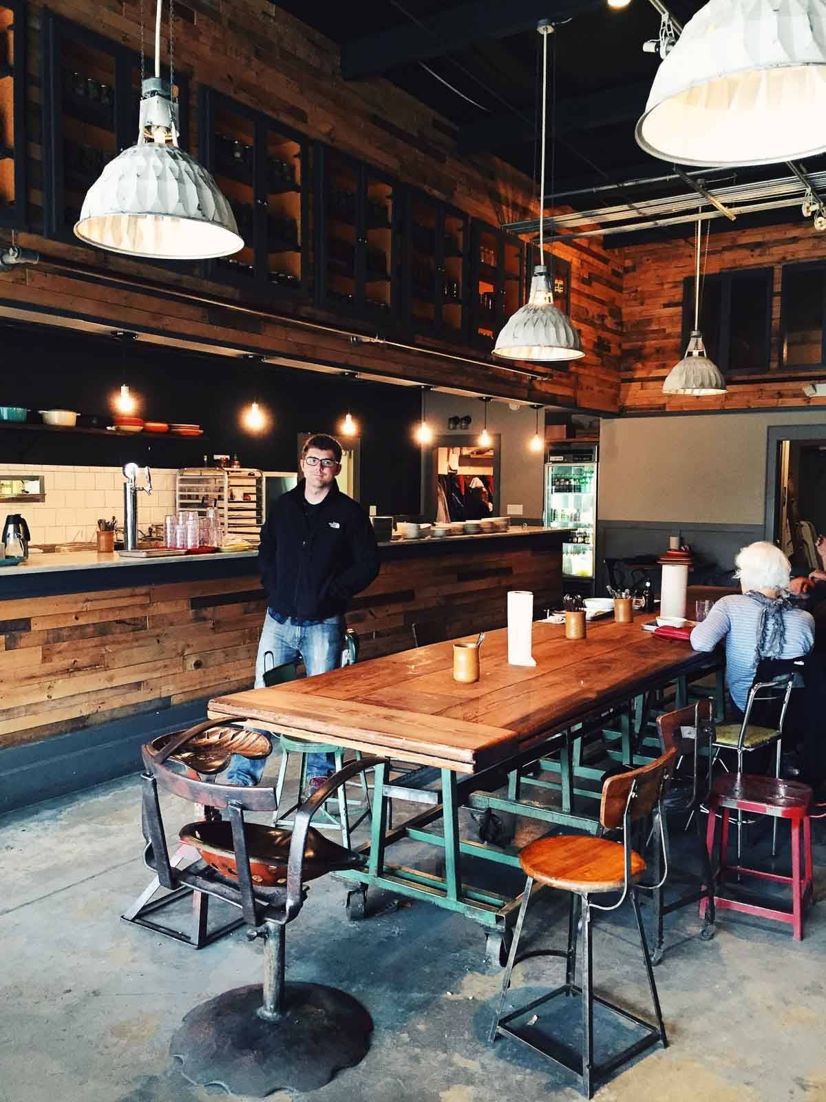 Restaurant with wooden tables and walls.