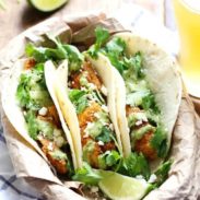 Crispy Fish Tacos with Jalapeño Sauce - beer-battered with a cornmeal crust for an extra yummy texture, plus the spicy-cool combo of that creamy jalapeño sauce. Summer food! | pinchofyum.com