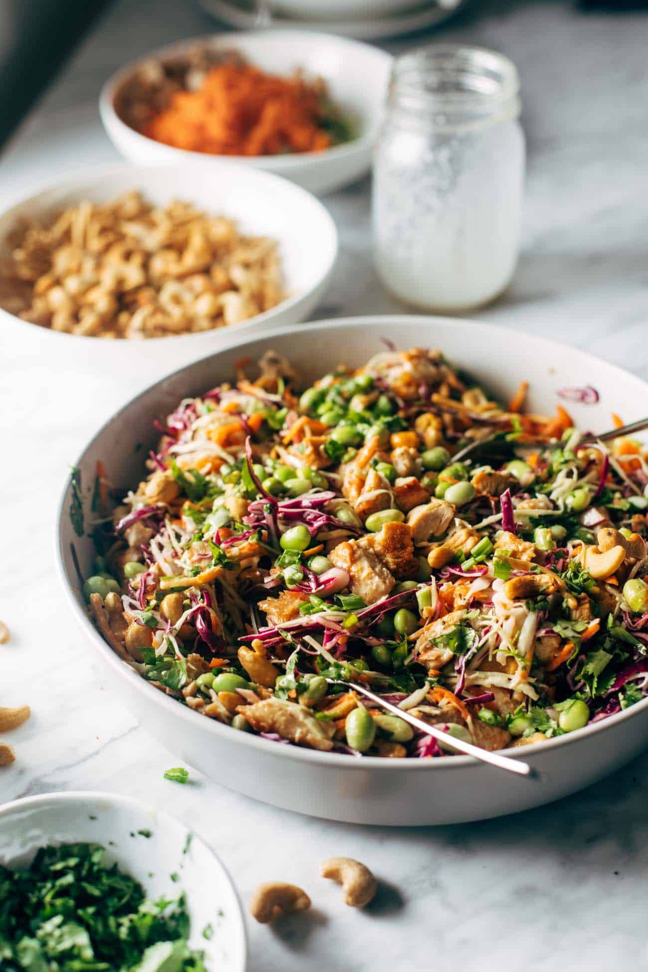 Cashew Crunch Salad in a bowl with a spoon.