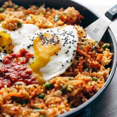 Kimchi Fried Rice in pan with runny egg yolk.