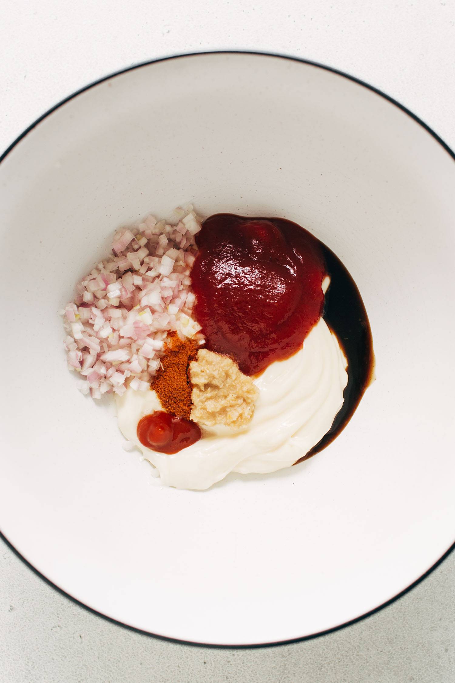 Ingredients in a bowl for the house sauce.