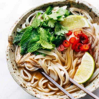 Turkey Pho in a bowl with chopsticks.