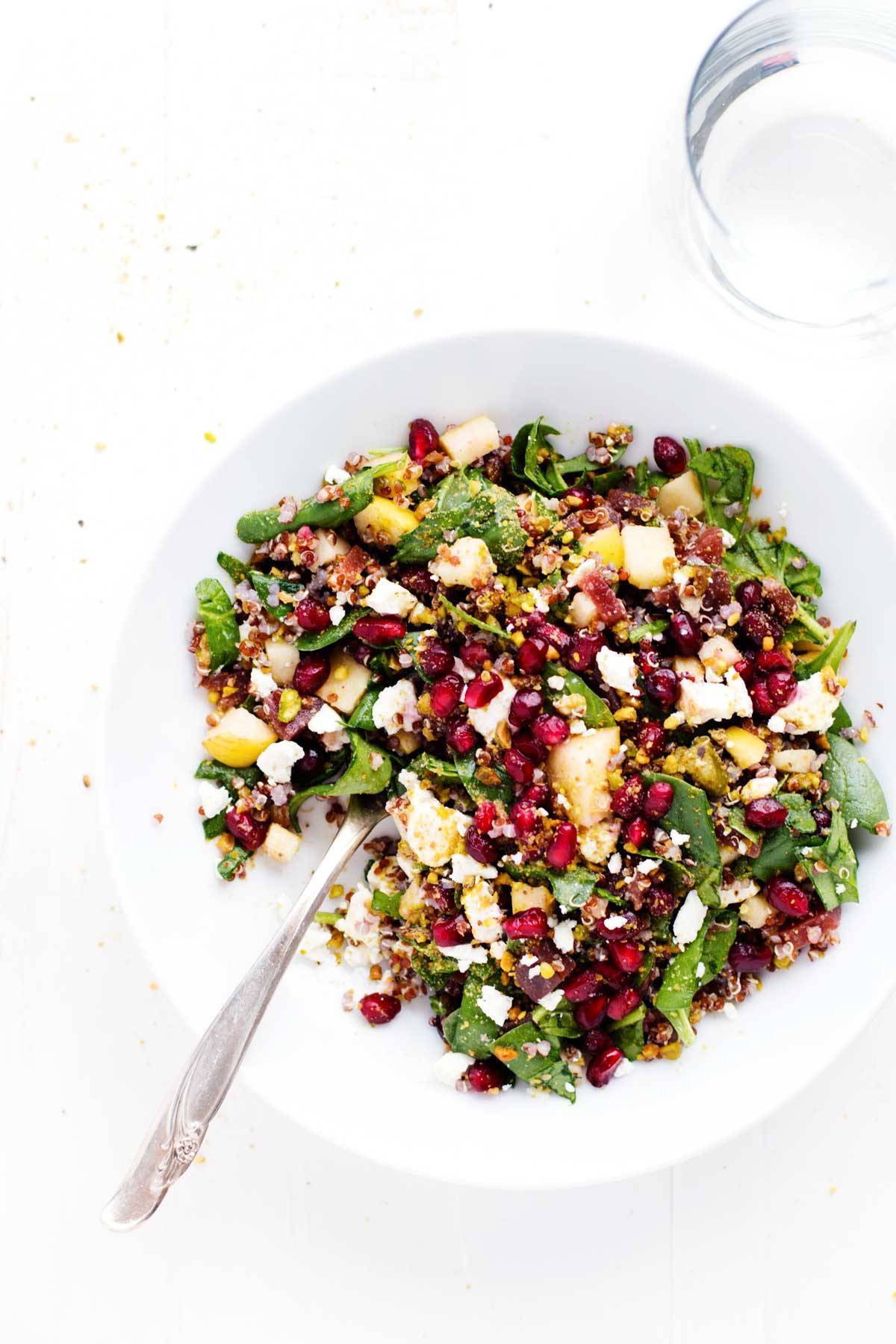 Quinoa Salad on a white plate with a fork.